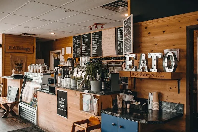 The EATology ordering counter with menu boards overhead